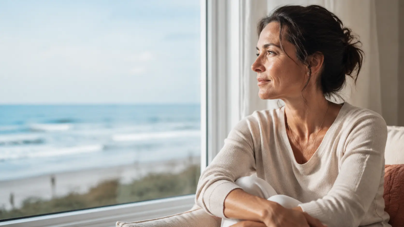 A person looking toward the Florida coast in soft daylight